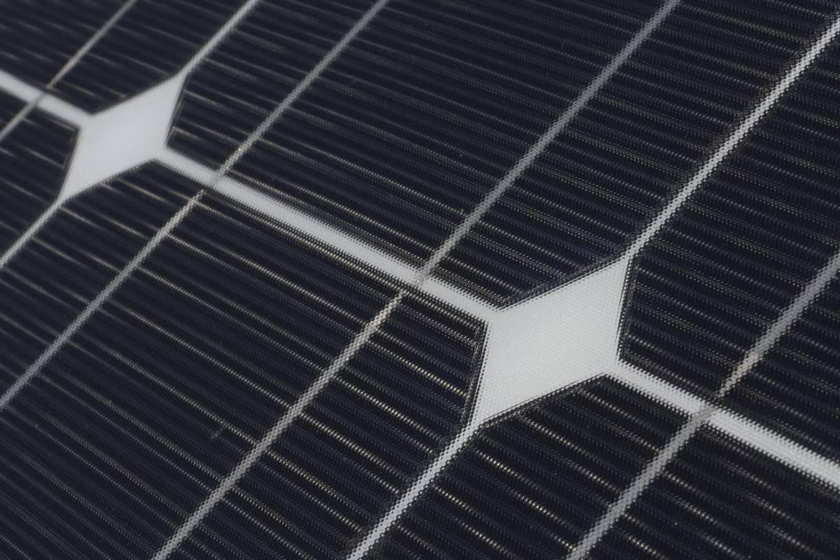 Close-up of clean, dark solar cells in bright sun